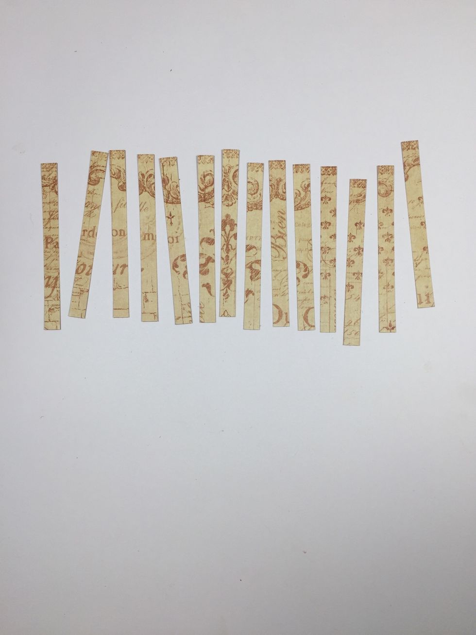 Cut two strips of light colored pattern paper for each banner tag, measuring 3/8" x 3 3/4" each.