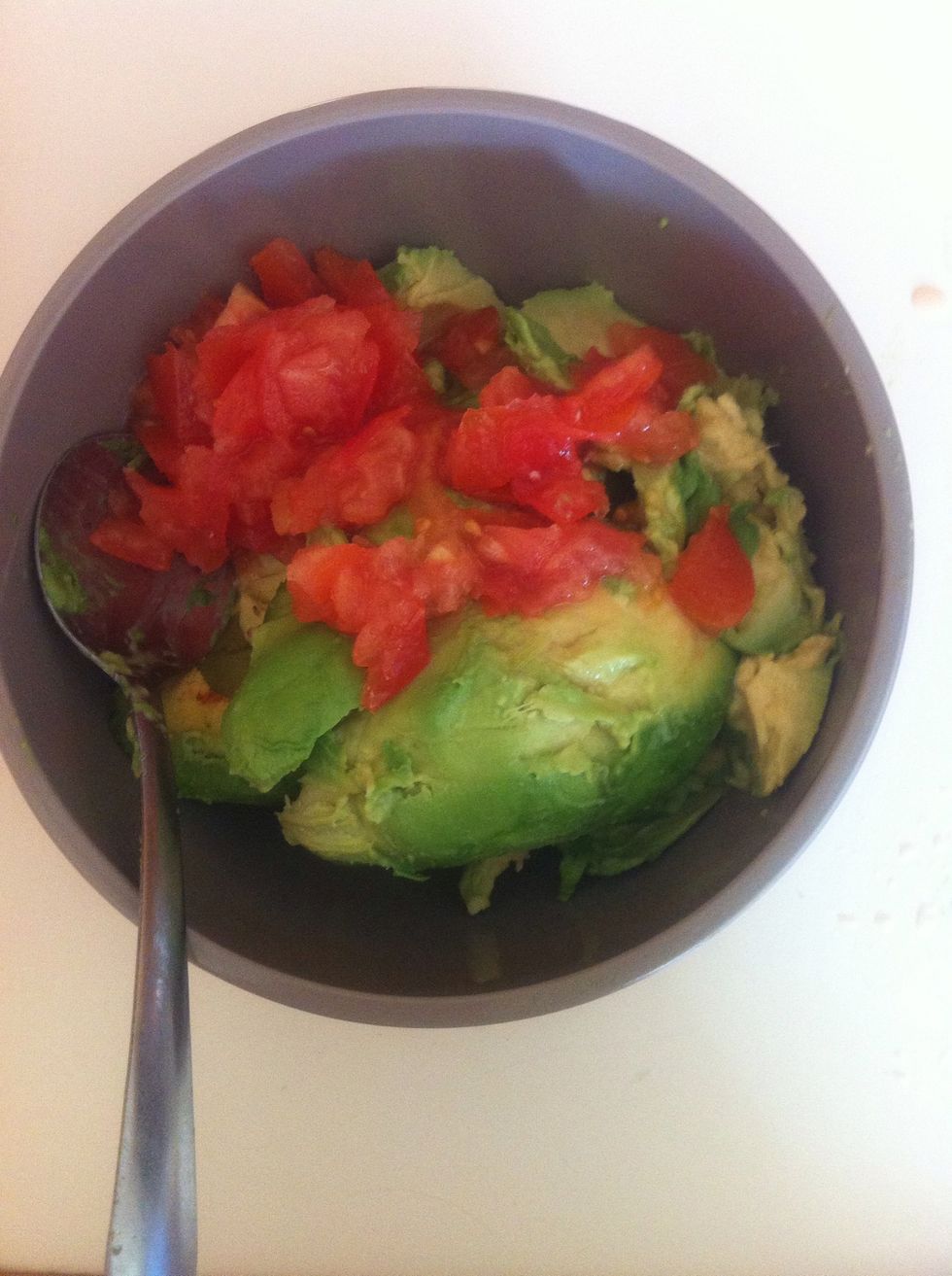 cut up 1 tomato very fine and add it to the bowl.