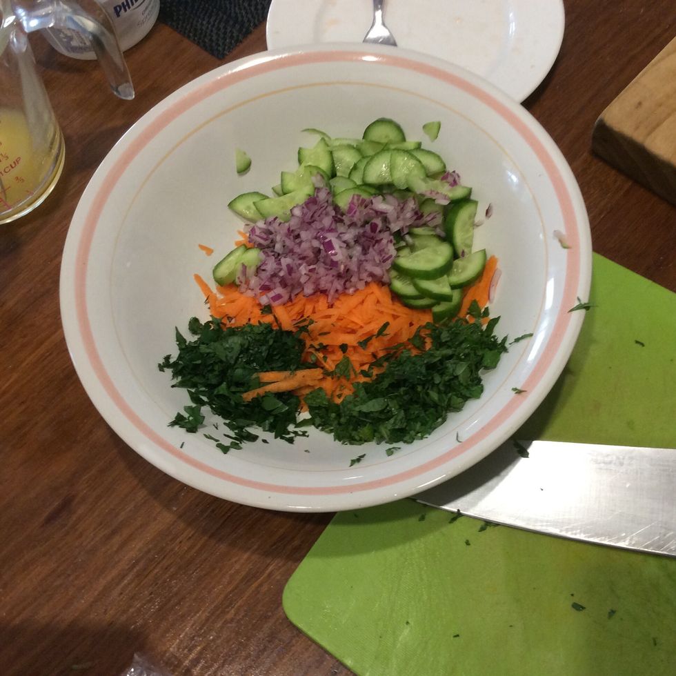 Cut up all the ingredients and put them into a bowl.