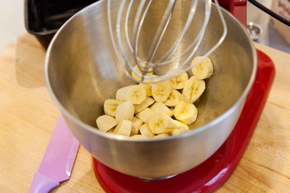 Cut up banana and place in electric mixing bowl.