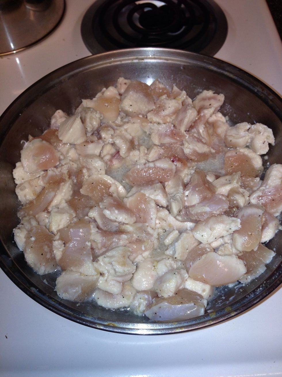 Cut up chicken breasts into bite size pieces. I used 3 boneless, skinless breasts. Season to your liking & cook until no longer pink. Also have frozen spinach thawing out. I sat my bag in hot water.