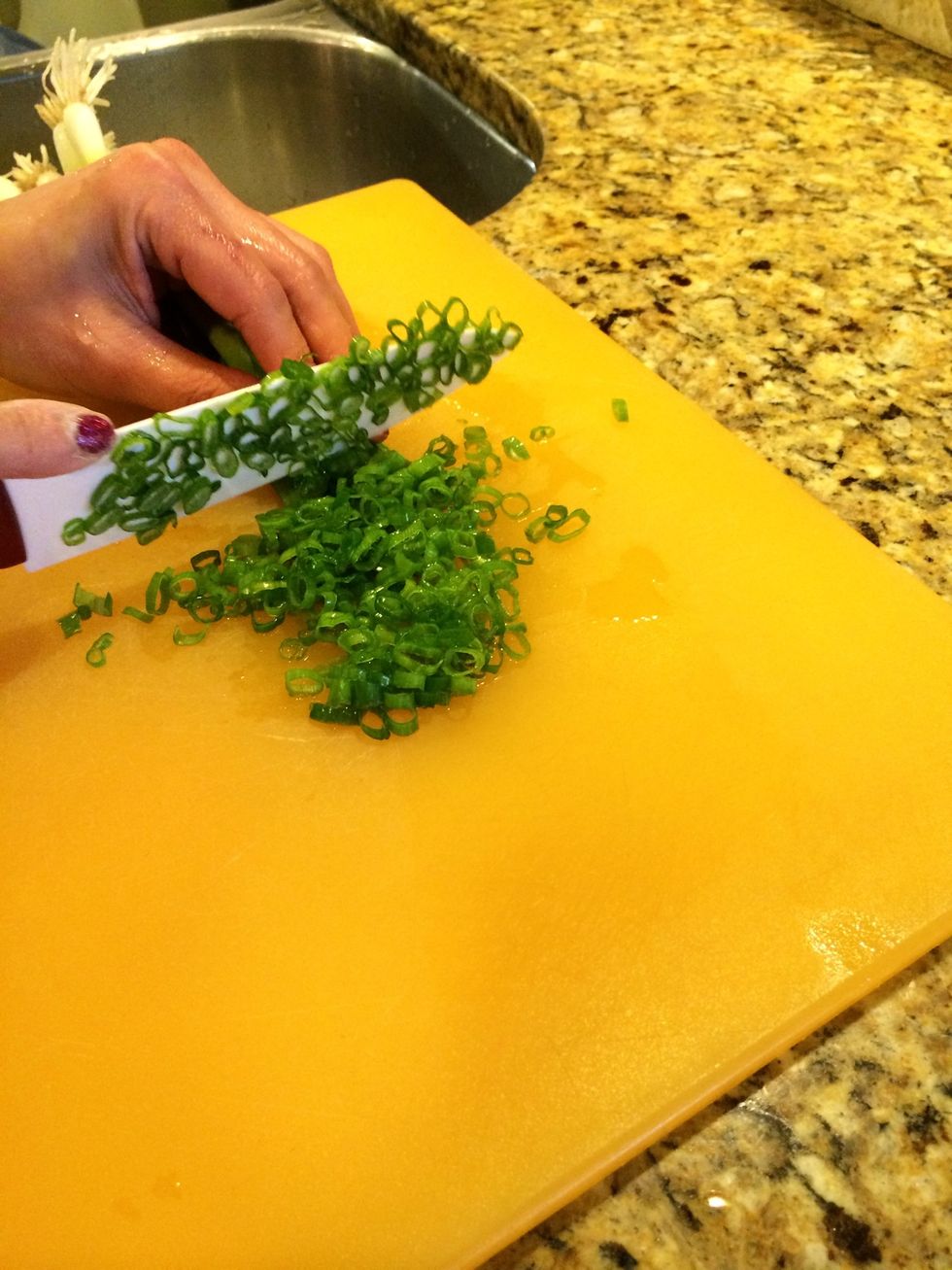 Cut up green onions.