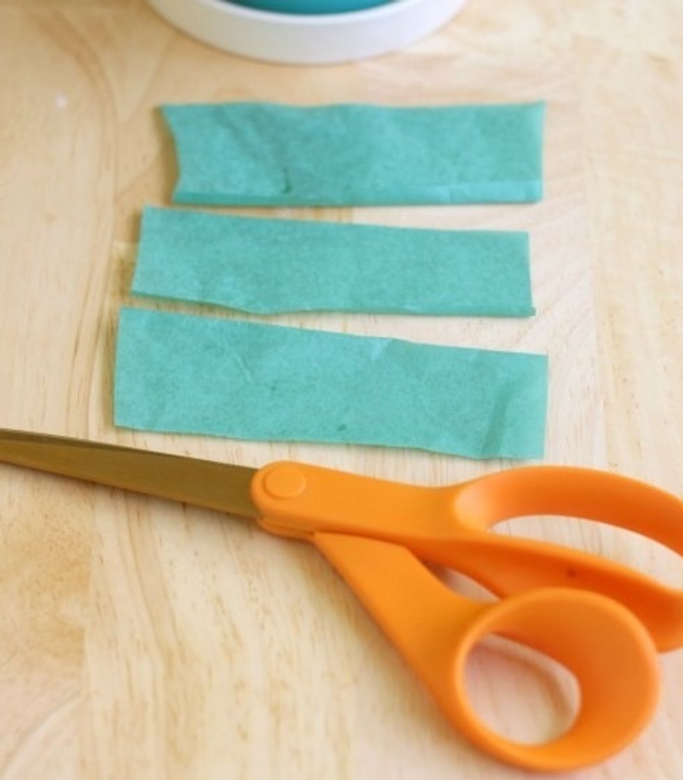 Cut up green pieces of paper