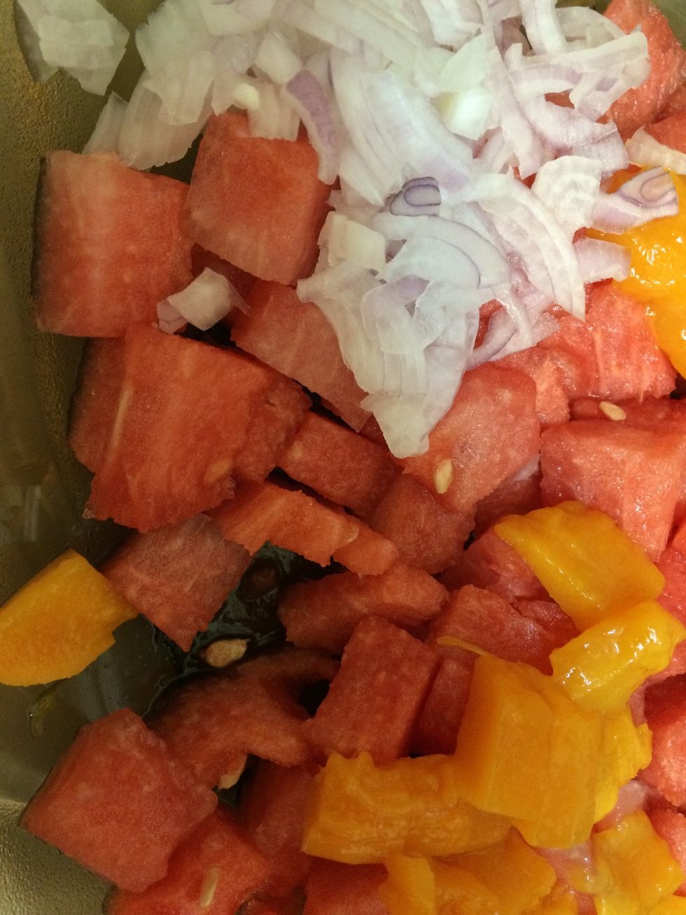 Cut up onion, watermelon and mango