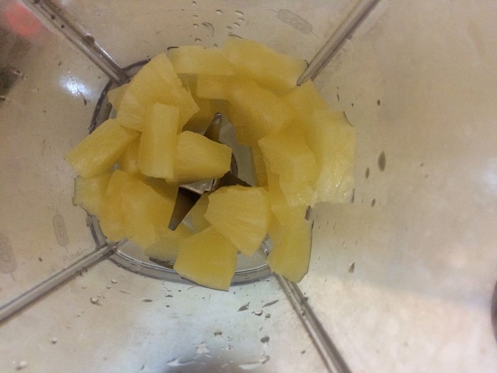 Cut up pineapple slices into chunks