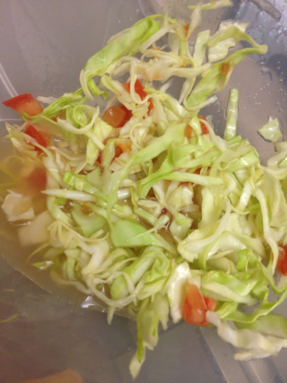 Cut up some Cabbage, thinly sliced, also chop up some Tomatoes and put them in a bowl. Squeeze about 4 limes into the bowl, I like it juicy. Sprinkle with salt.