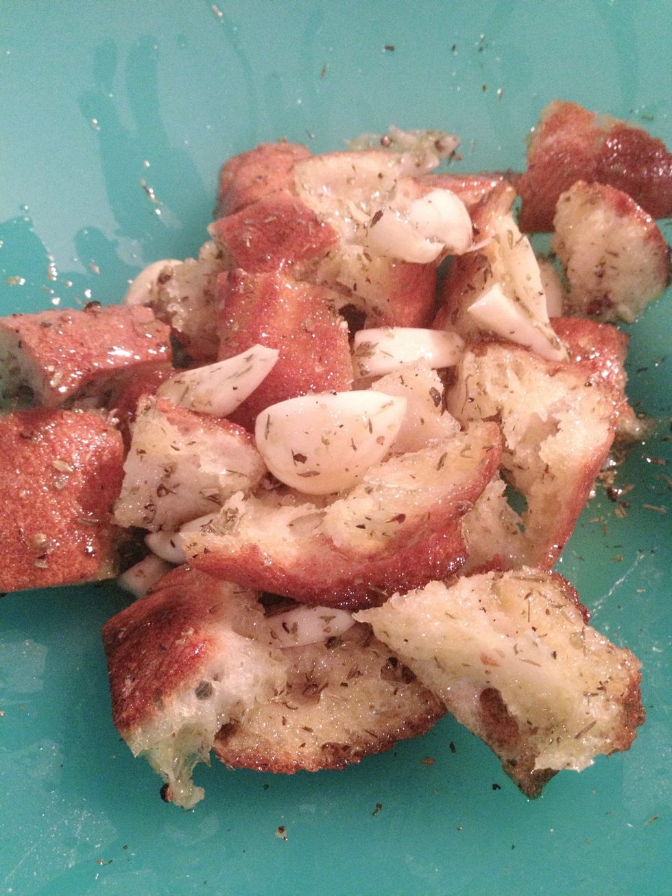 Cut up the bread into little pieces and mix them with the oil mixture. Let it soak for 15-20 minutes.