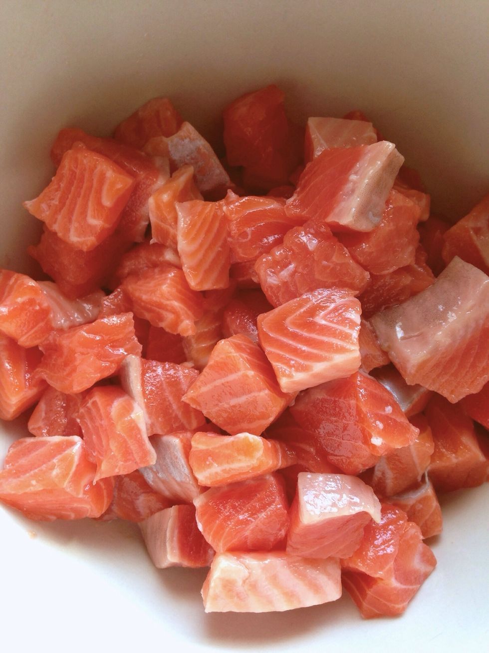 Cut up the fish into small cubes and place into a bowl. Set aside for later use.