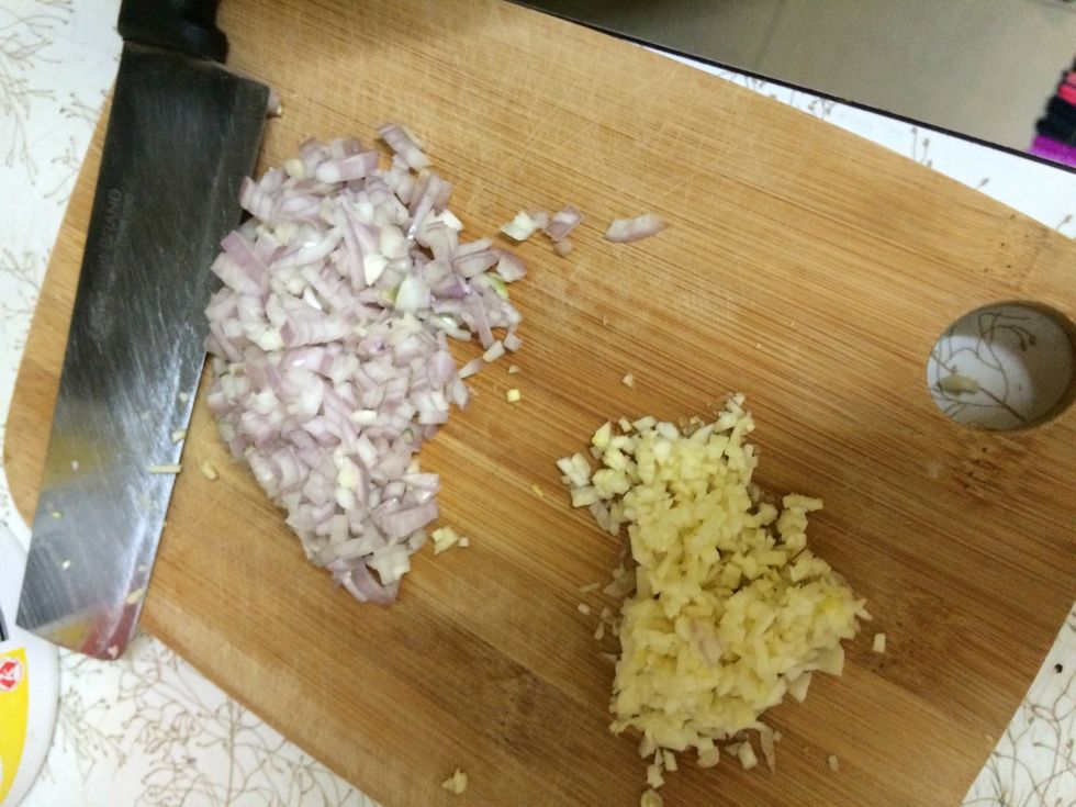 Cut up the garlic after the onions are chopped up