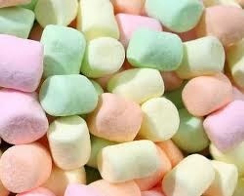 Cut up the marshmallows in to little bits (if hard to cut dip scissors in hot  water) and set aside in a bowl