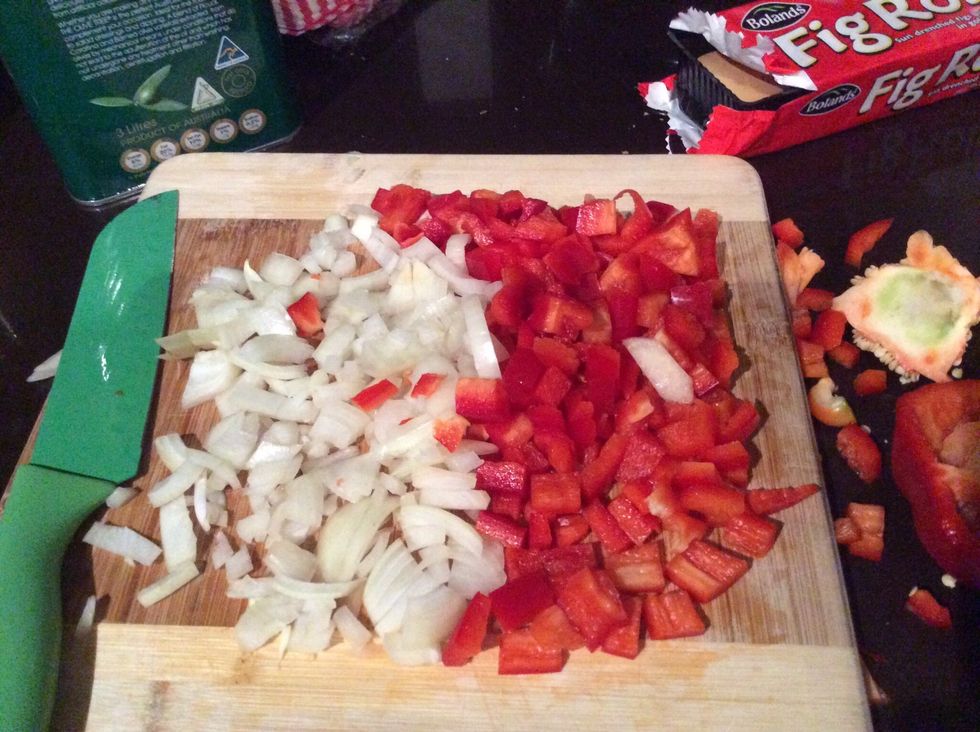 Cut up the onions and peppers.