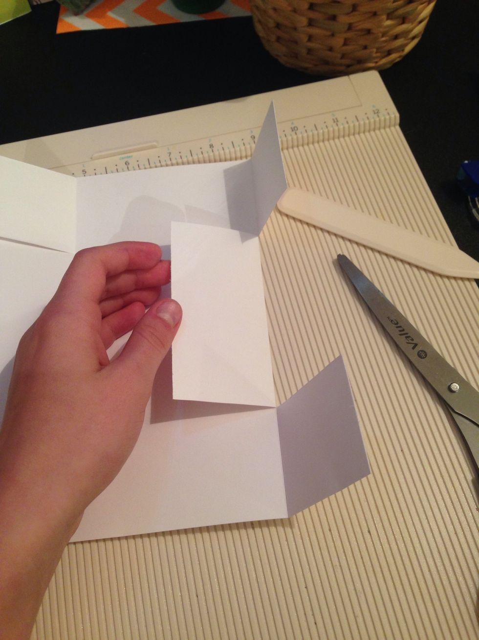 Cut up the score lines on each side of long middle panel on two opposite sides only