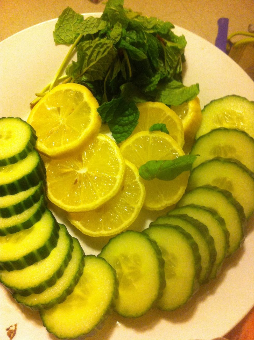 Cut up your cucumber lemon and tear mint leaves.