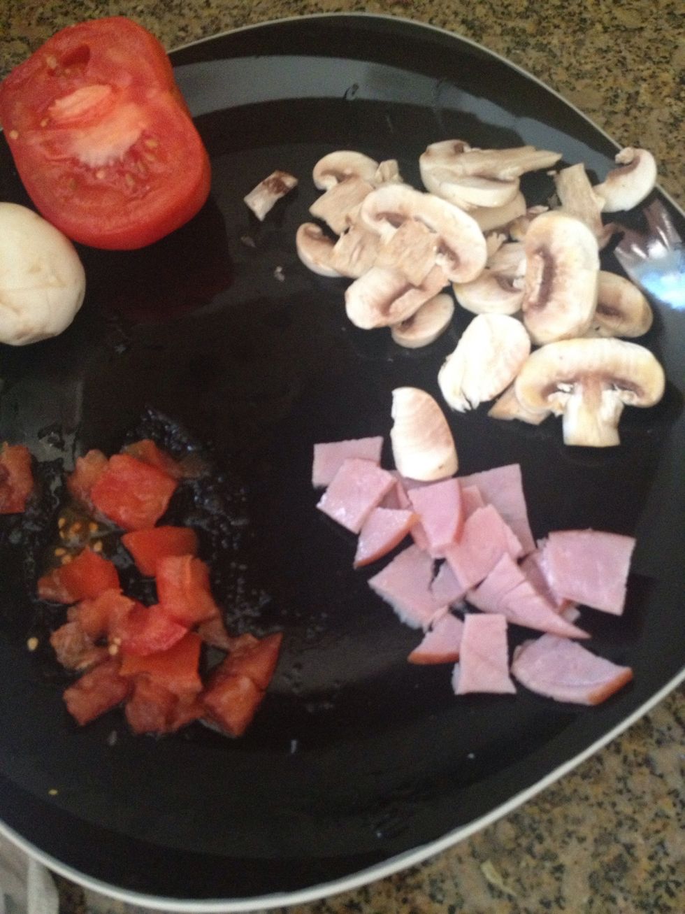 Cut up your ingredients: Canadian bacon, tomatoes, mushrooms