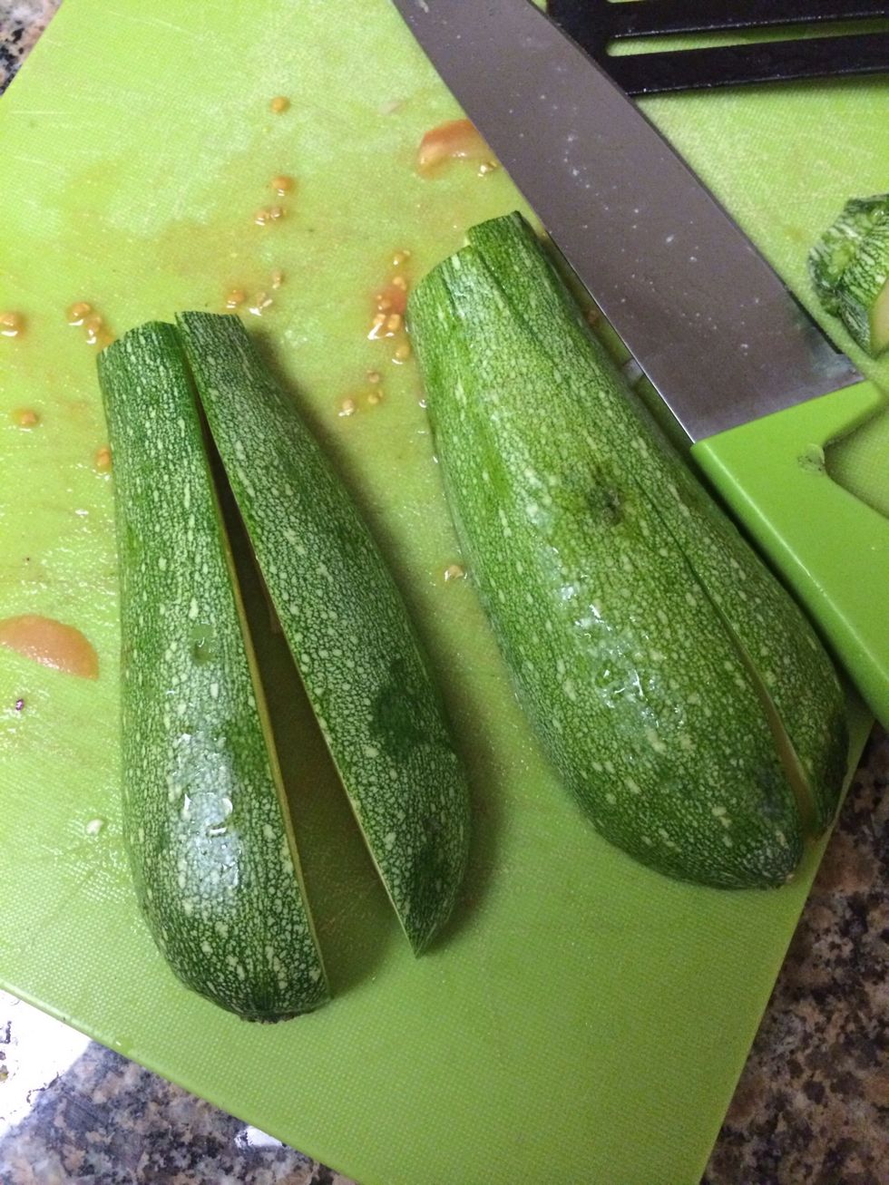 Cut up your zucchini is quarters then slice them up