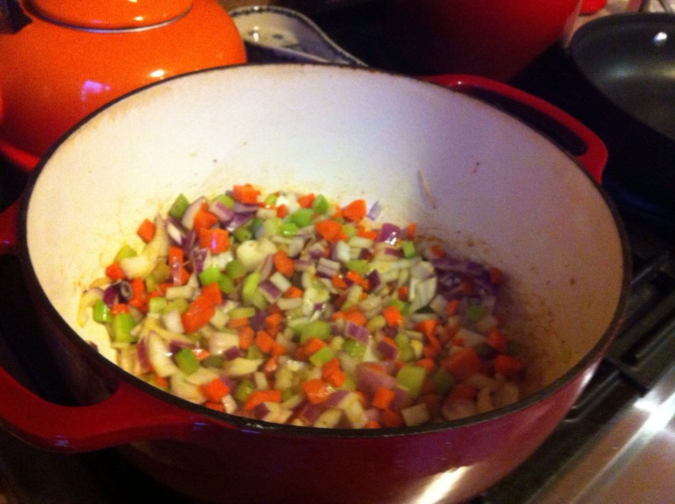 Cut vegetables into small dice. Add remaining oil to Dutch oven and cook until they begin to soften, about 10 minutes.