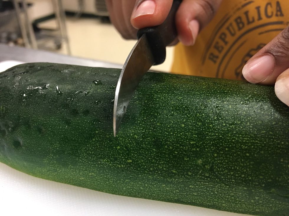 CUT WITH CURVED SIDE OF KNIFE.