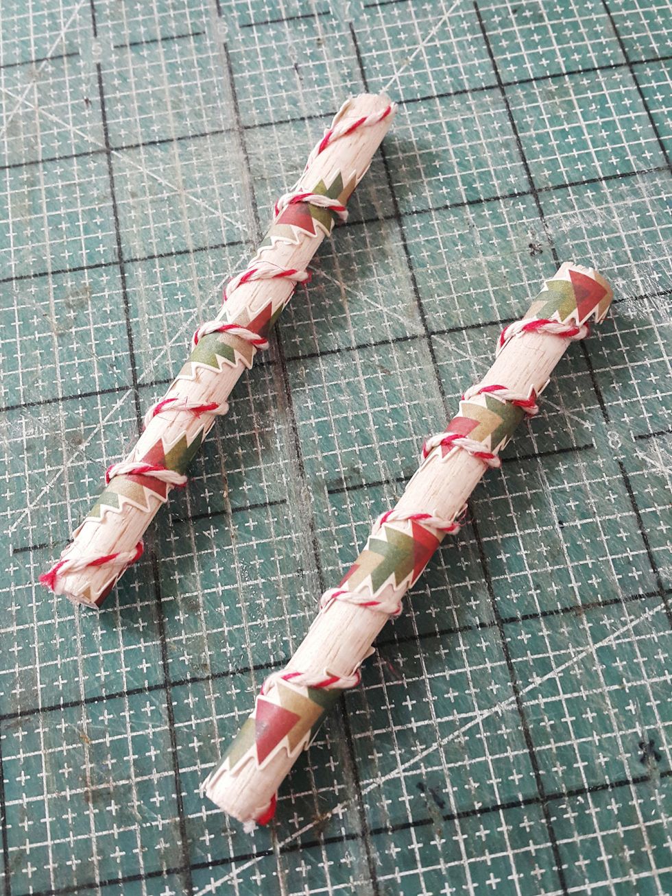 Cut wooden stick of 4" and decorate with stickers and twines.