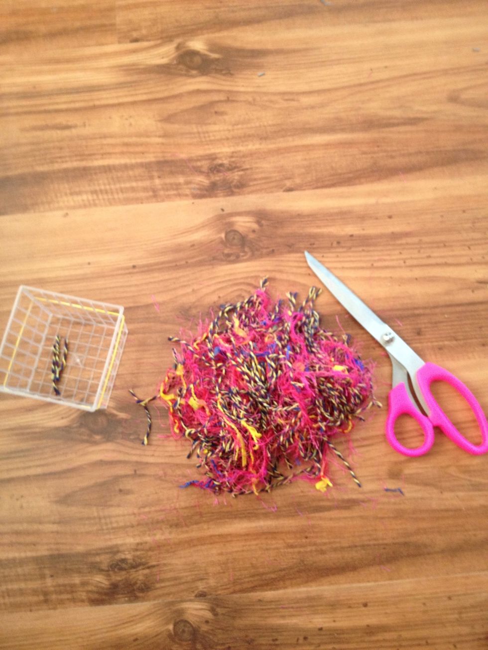 Cut yarn into any size bits, not too small tho. I'd say no less then about an inch. You want the birds to use this as filler for there nest.