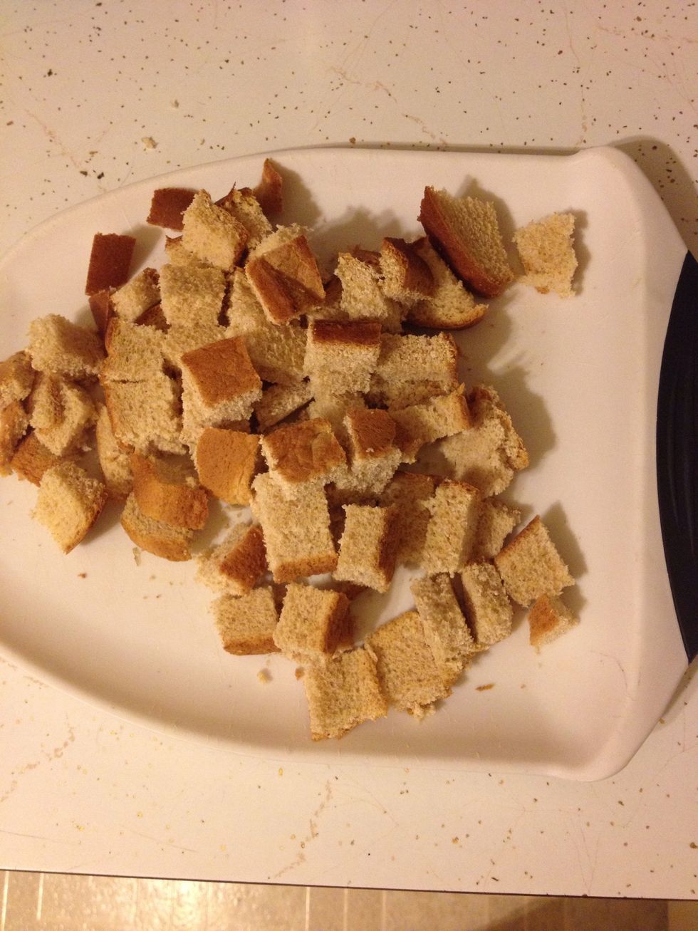 Cut your 6 slices of bread into 1 inch cubes.