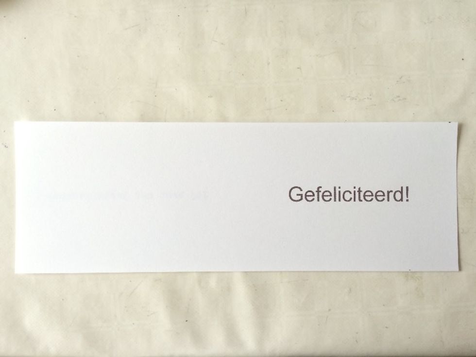 Cut your A4-sized cardstock in half, lengthwise. So you\u2019ll cut on the 21 cm (8.3\u2033) side, as shown.