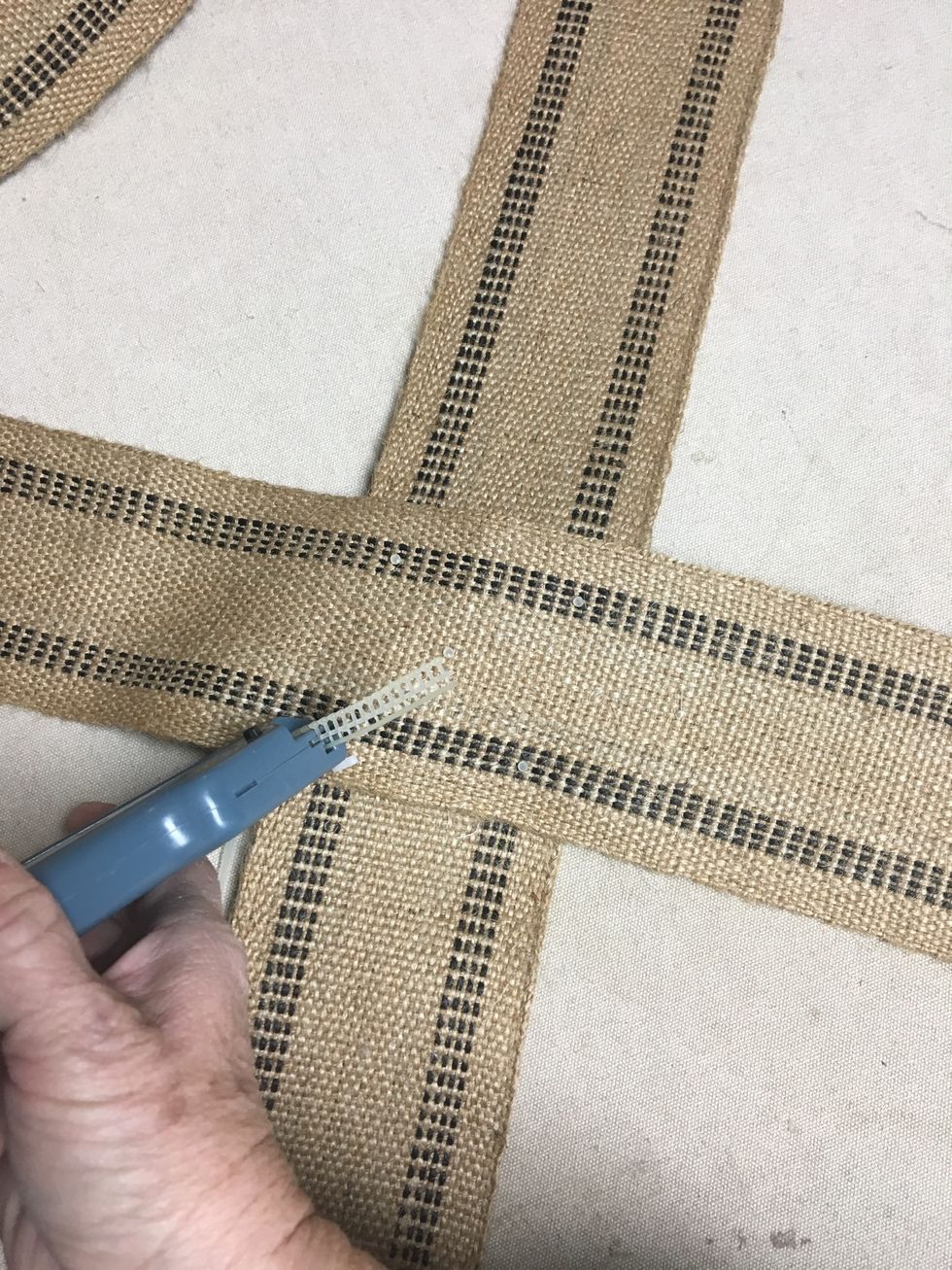 Cut your banding into 2 equal pieces.  Fold each and mark the middle of each strip.  Cross the bands at the middle points and tack using a Tack Gun or stitch.