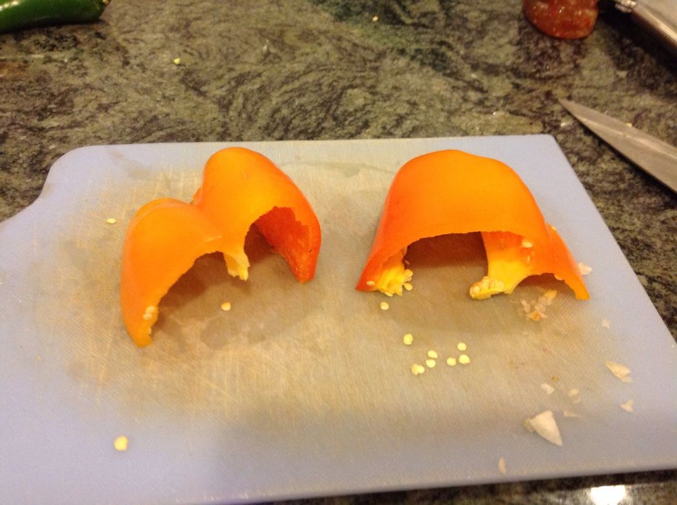 Cut your bell pepper stems off. Then cut them in half.
