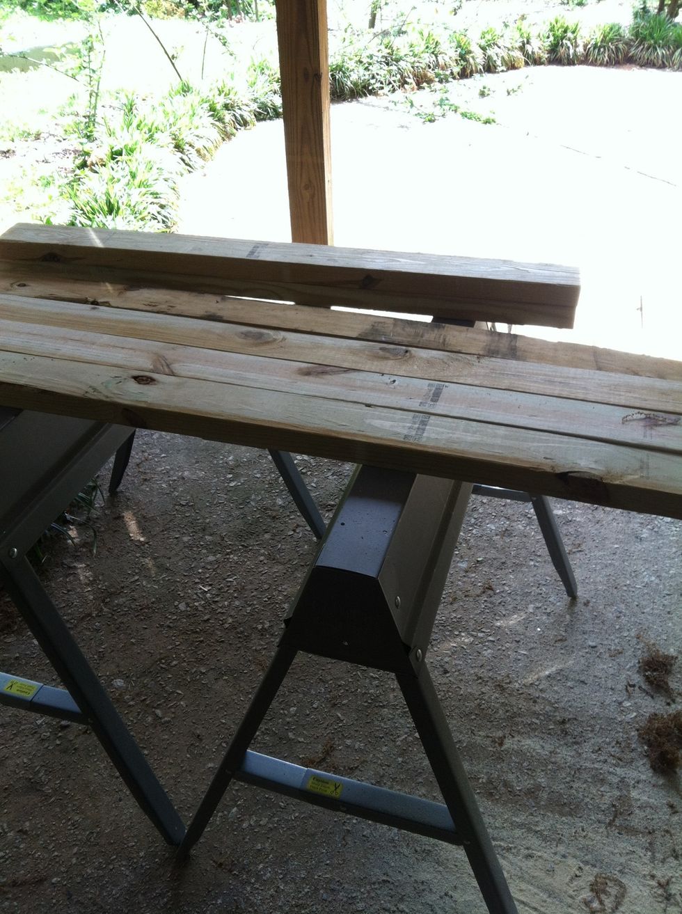 Cut your board to size that fits plant. Make 2 sides shorter by twice the thickness of the board if you want a perfect square.