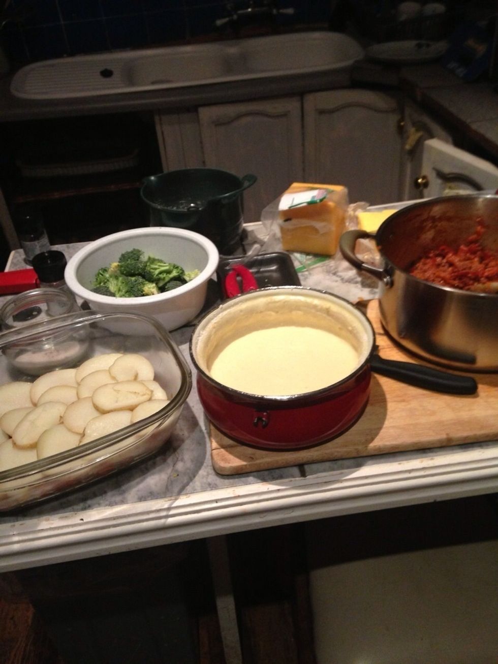 Cut your brocolli up into florets. Cut those in half lengthwise. Cut the cooked potatoes onto thick slices.