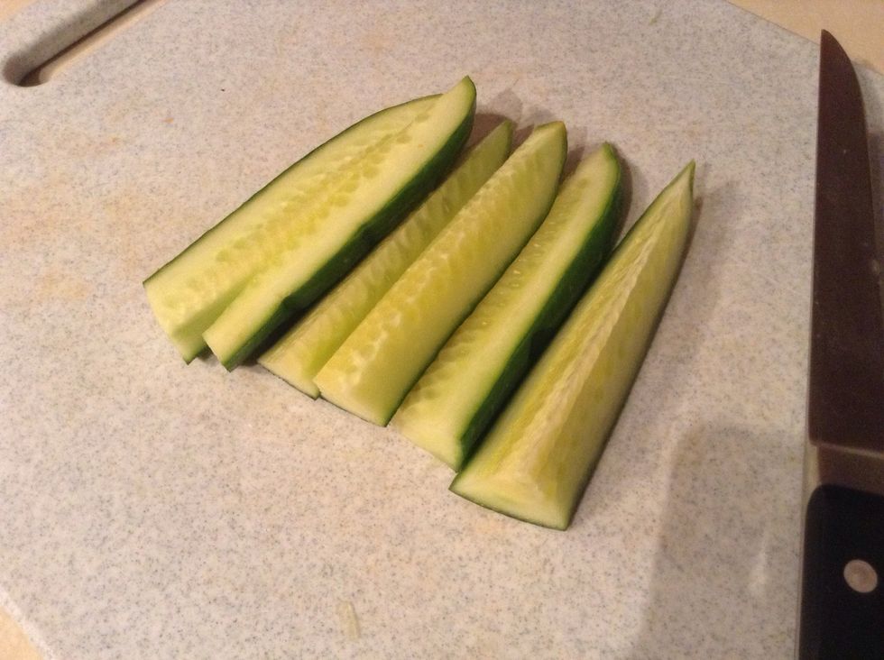 Cut your cucumber in half, then half again