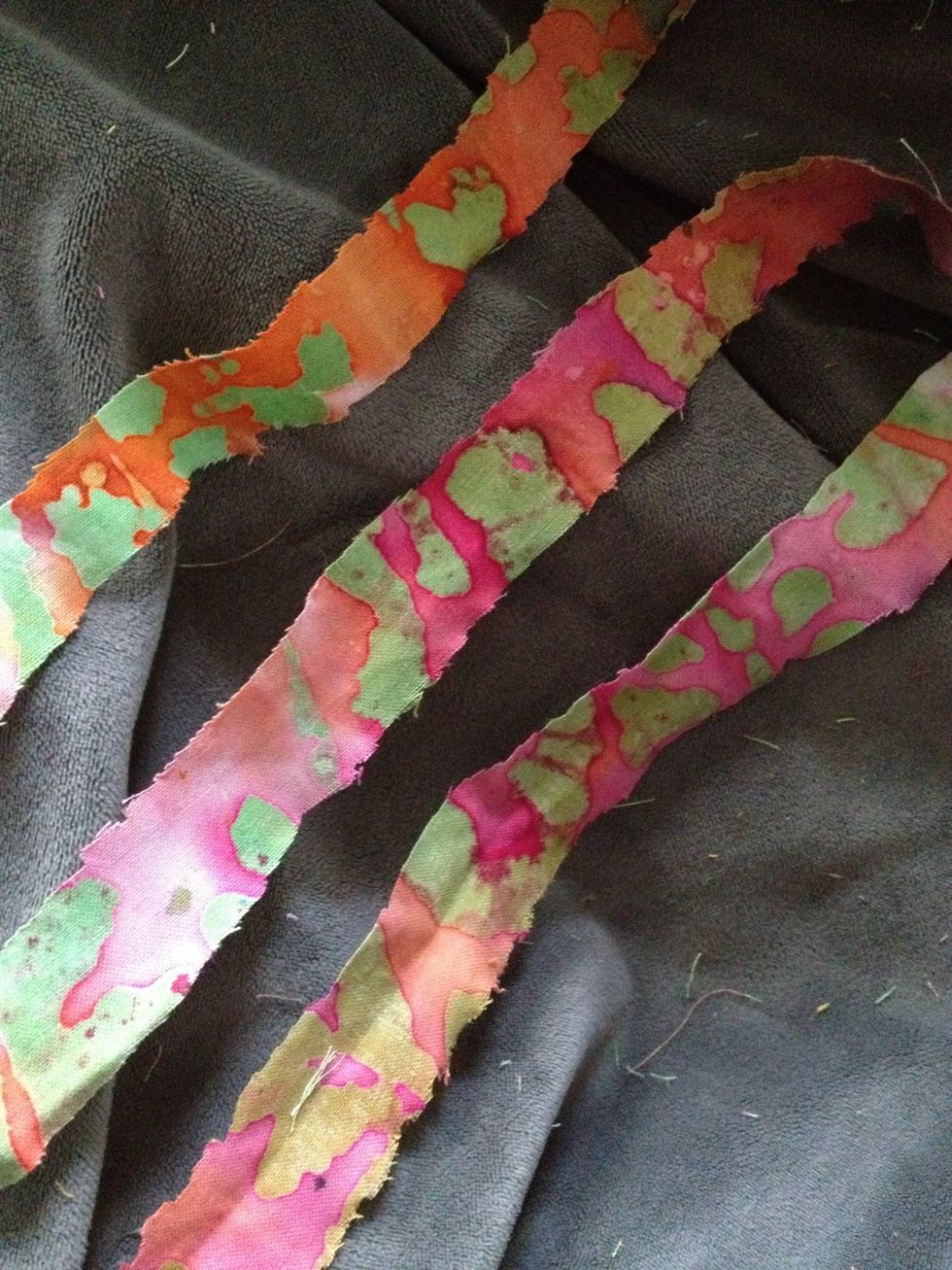 Cut your fabric into strips about an inch in width but perfection doesn't matter