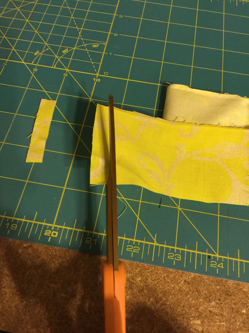 Cut your fabric remnants into small strips.