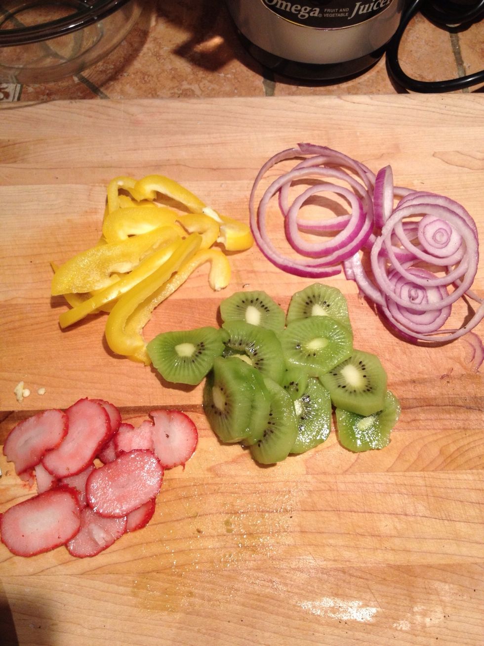 Cut your fruit and veggies I used frozen strawberries will use fresh next time that's 1/2 of yellow pepper