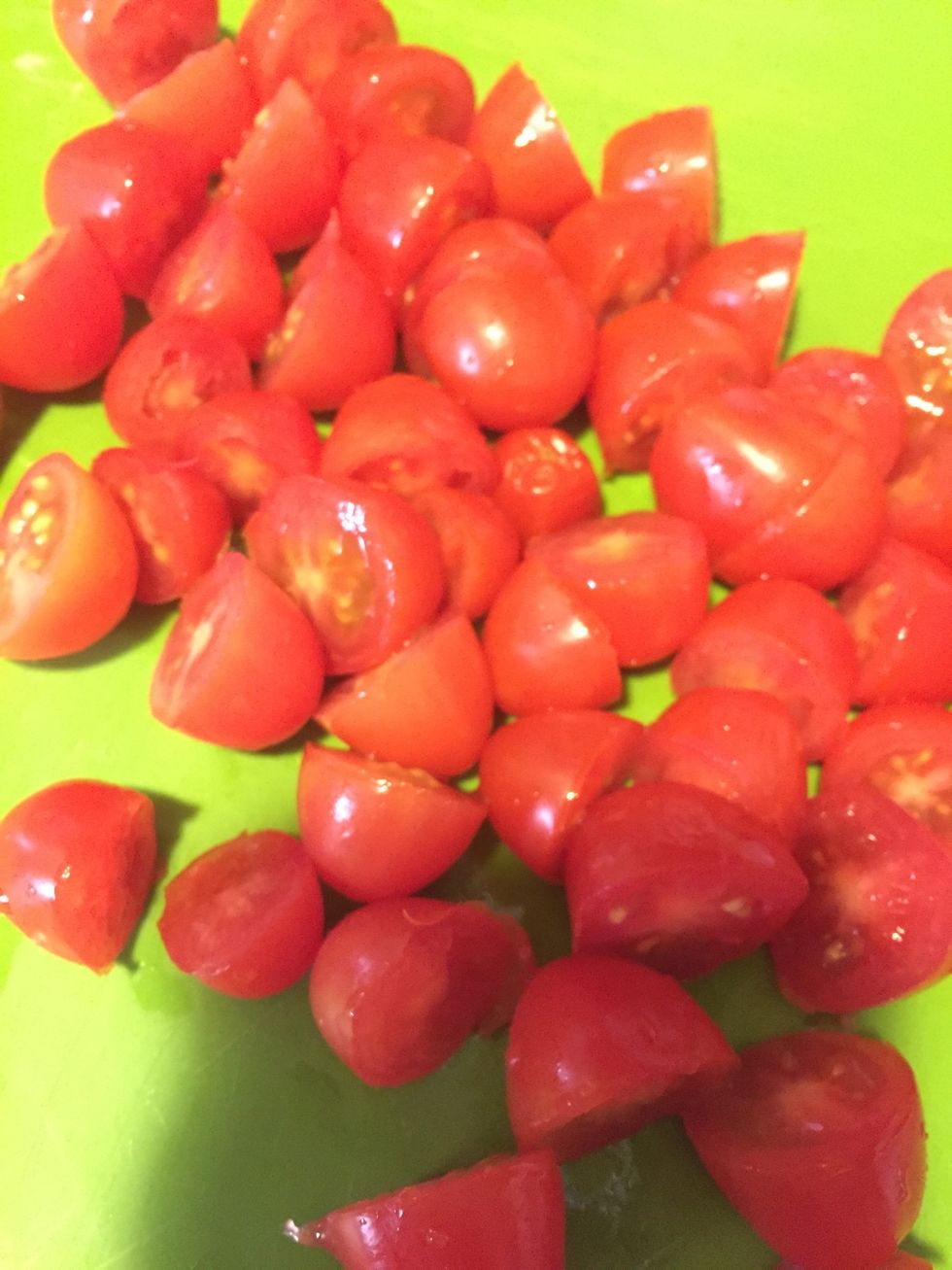 Cut your grape tomatoes in half. Make sure you wash them and set them on a bowl lined with paper towel so they are not too wet when you cut them