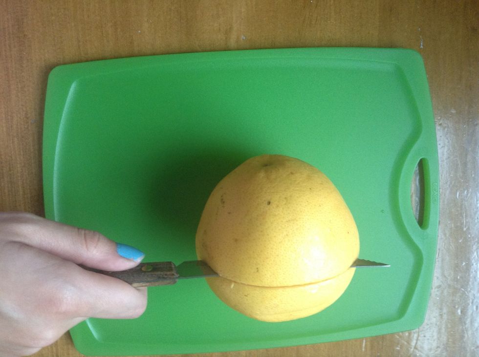 Cut your grapefruit in half between the two ends.