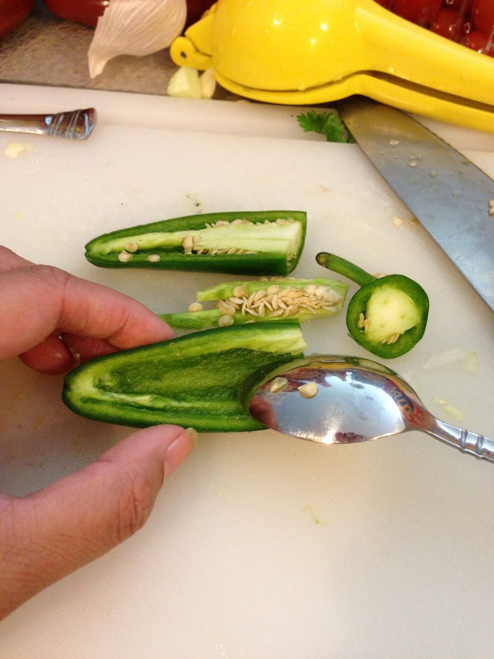 Cut your jalape\u00f1o pepper in half. Carefully remove the seeds and stem inside. Wash your hands immediately and avoid touching your eyes or they will burn baby!!! \ud83d\udd25\ud83d\ude35\ud83d\ude32