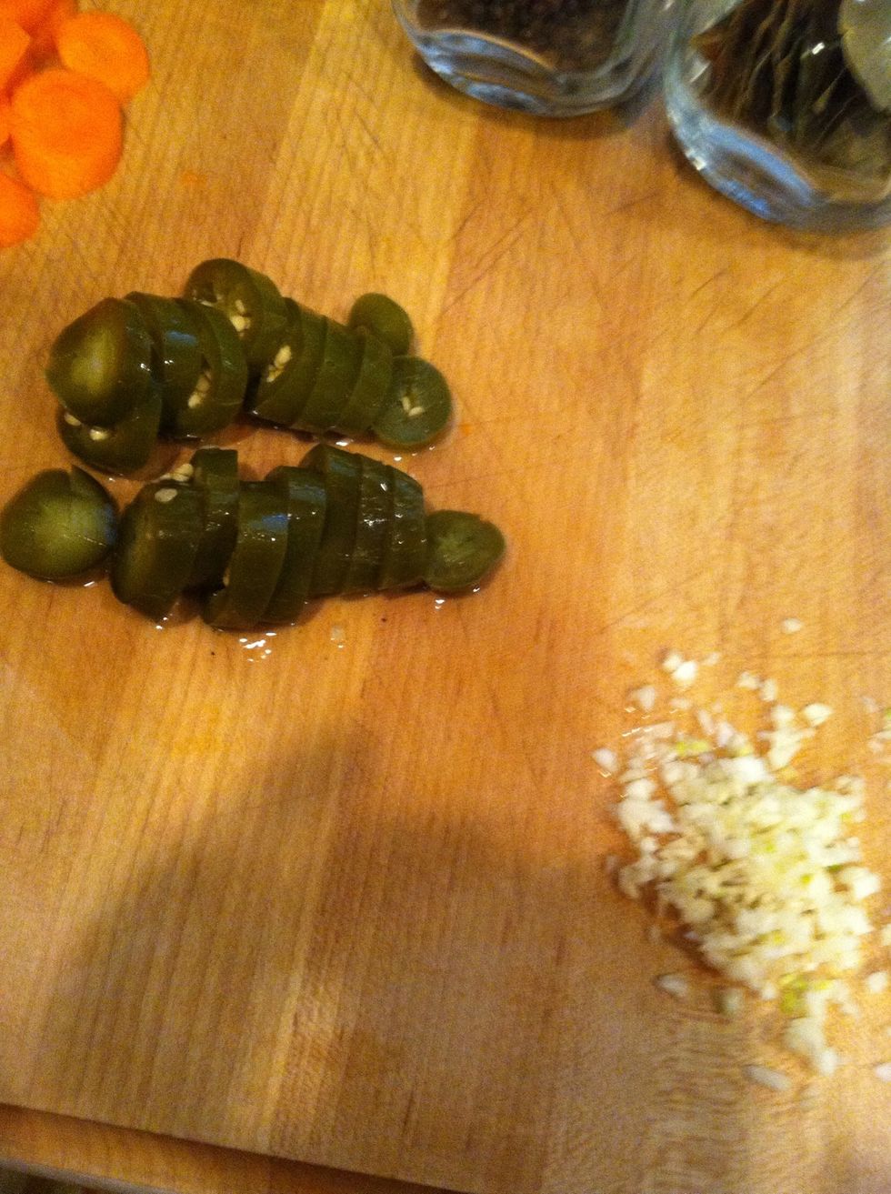 Cut your jalape\u00f1os, peel and minced your garlic cloves