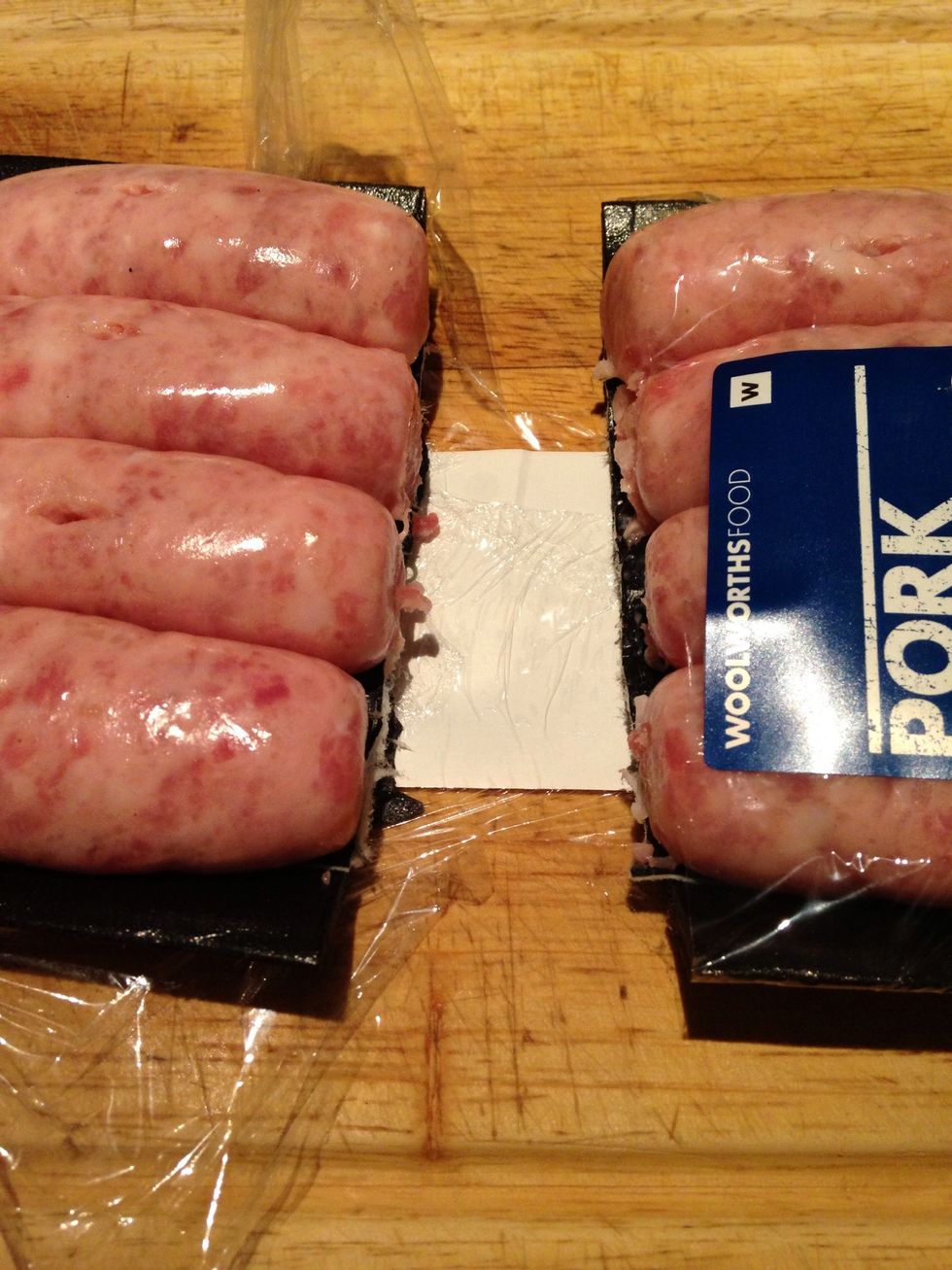 Cut your porkies apart while still in the packaging - way easier. Separate the other ends whilst in the packaging as well. Heat a pan, add oil and one smashed clove of garlic.