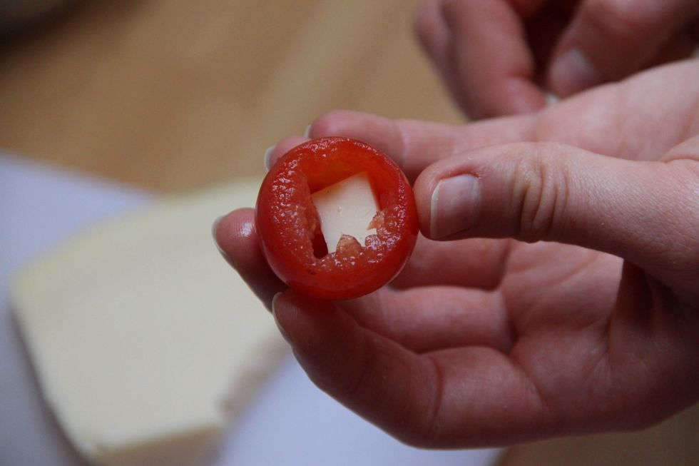 Cut your provolone cheese is small cubes and place inside tomato