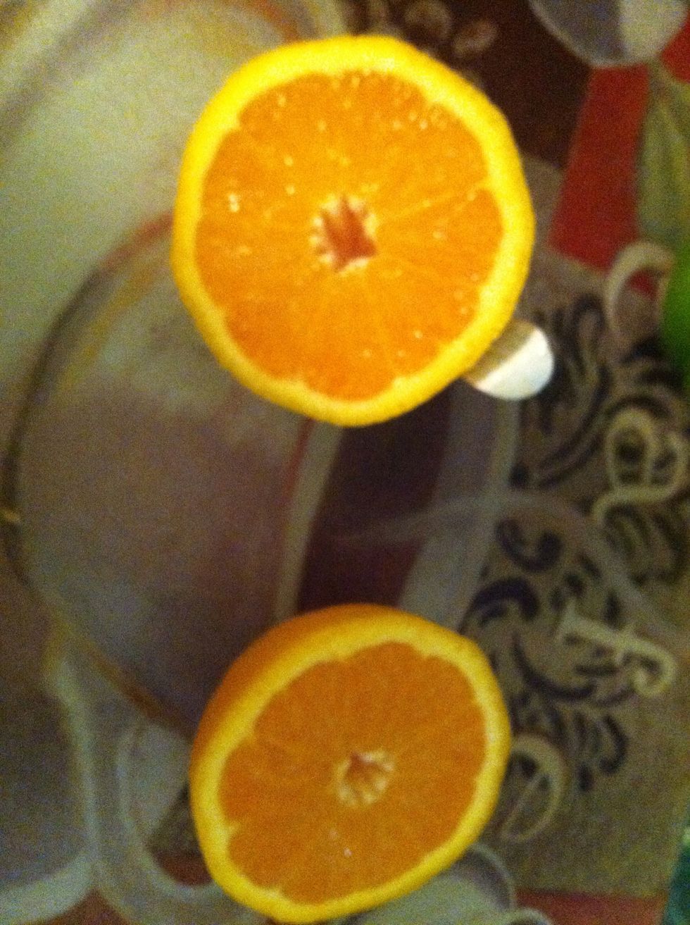 Cut your third orange in half