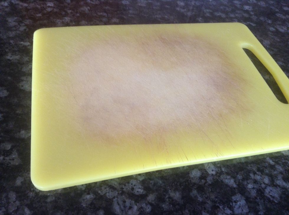 Cutting board. Used to cut stuff on it. I can use a cutting board to chop up some strawberries.