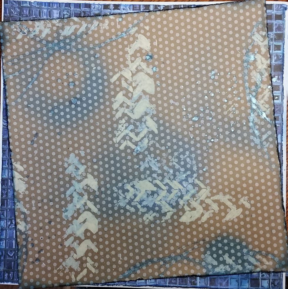 Cutting your background papers as shown, ink edges, and then use the Tattered Angels paint with stencil to make the patterns and let dry, then add in your mists and let it dry a final time.