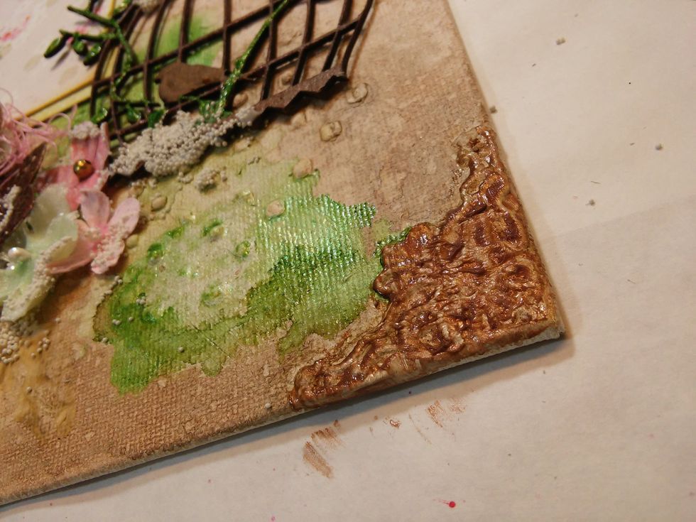 Dab a each corner piece with Copper Metal Effects and buff just enough back off to show the details in the piece.