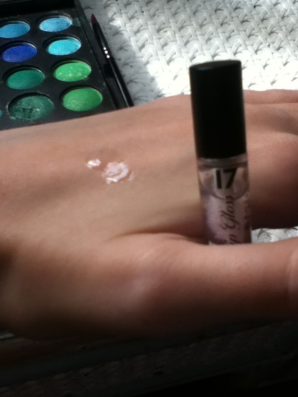 Dab some clear gloss onto your hand and swirl your lip brush in it.