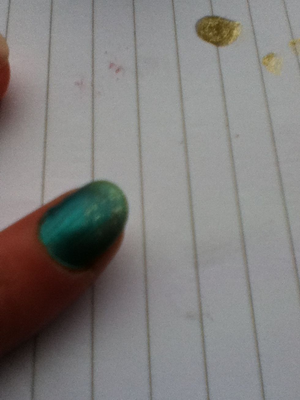Dab the glitter on the end of the nail.
