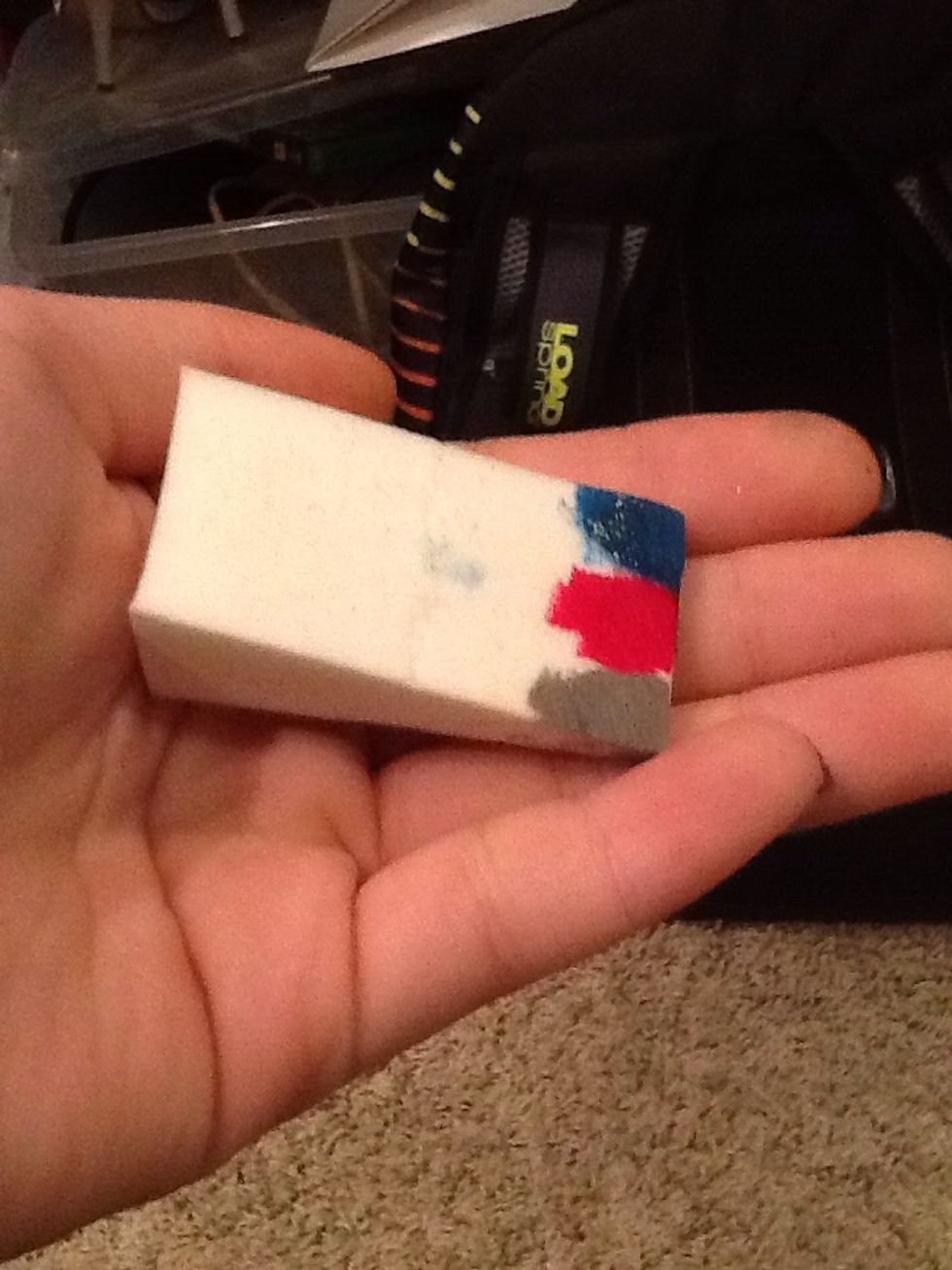 Dab the pink nail polish onto the sponge.