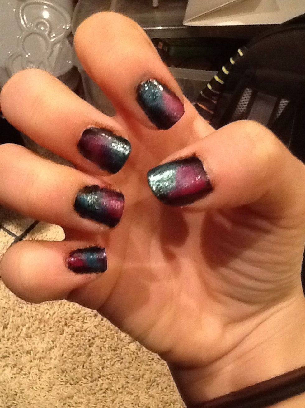 Dab the pink onto the other half of the grey. Try to mix the pink and blue on your nails, so it'll blend in together.
