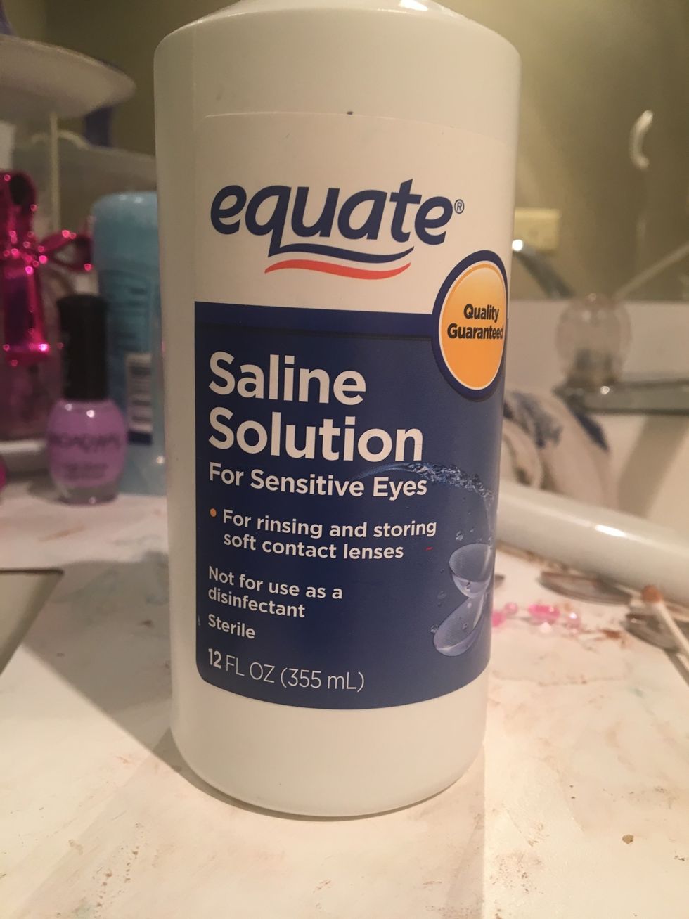 Dampen a tissue with saline solution and hold it on acne for 3 mins
