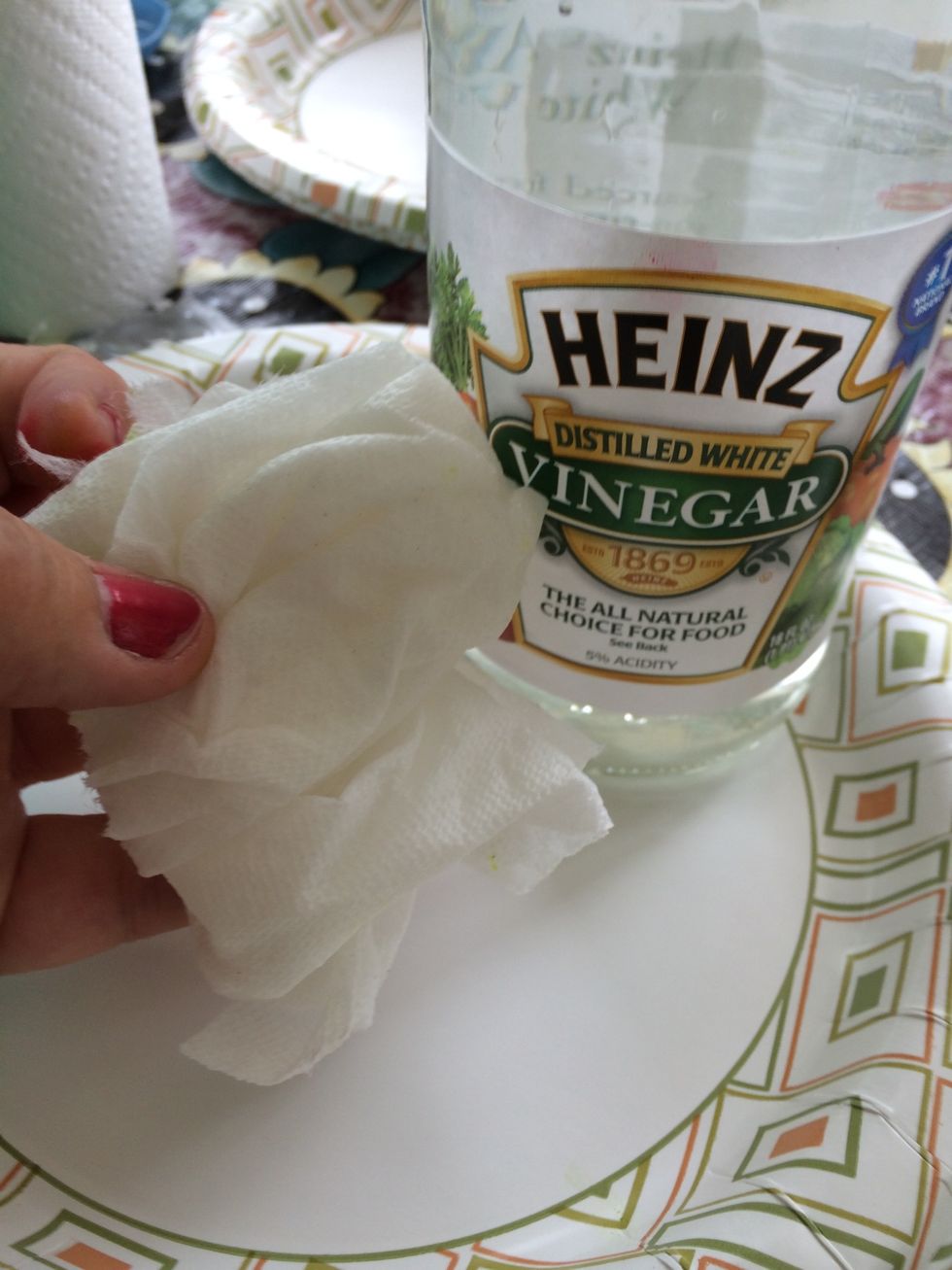 Dampen paper towel with water