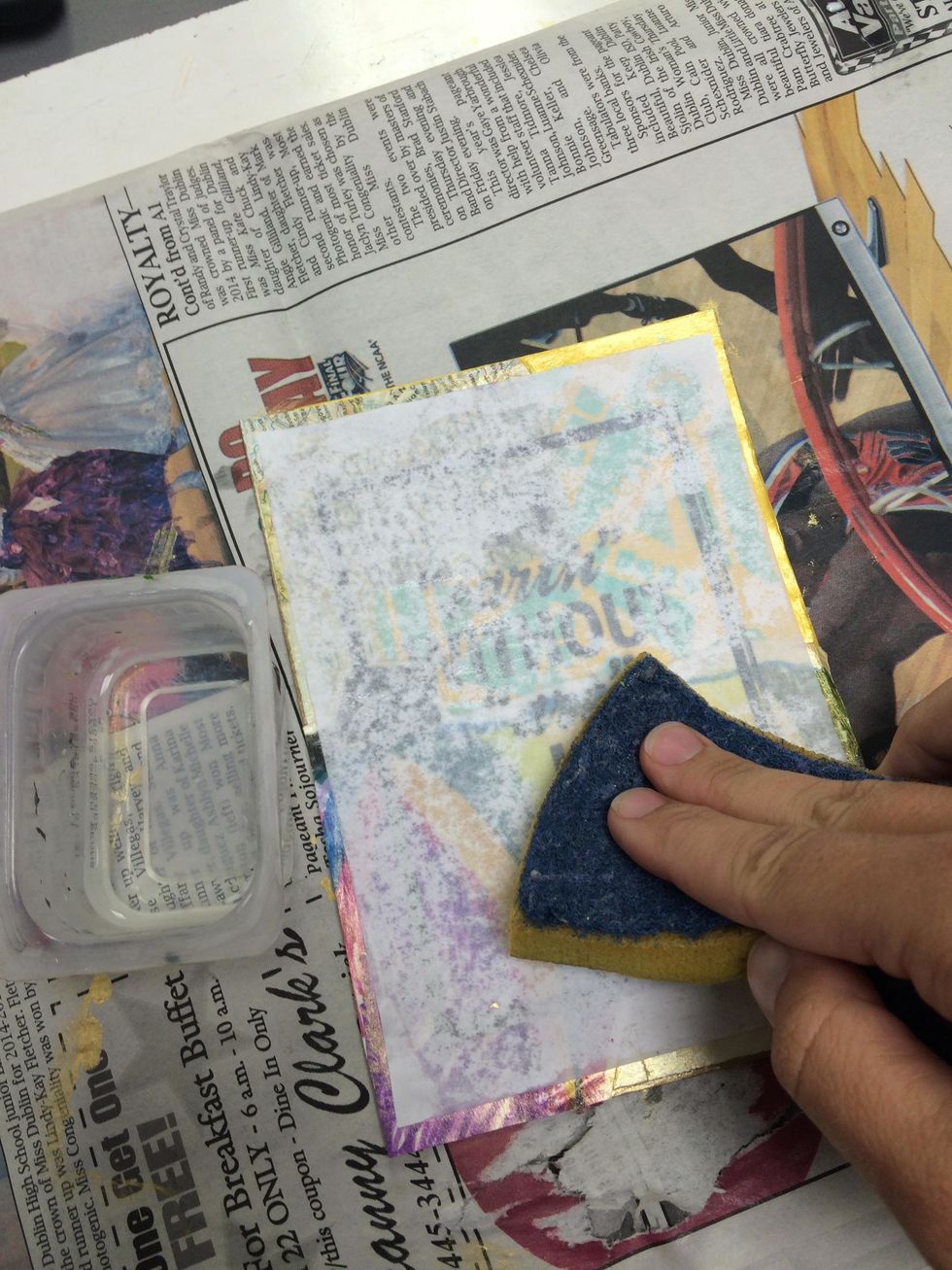 Dampen the paper until it becomes transparent.